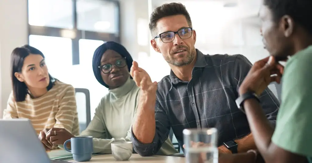 A diverse group of adults in a supportive therapy session circle, warm indoor lighting, mental health awareness concept, professional realistic photography